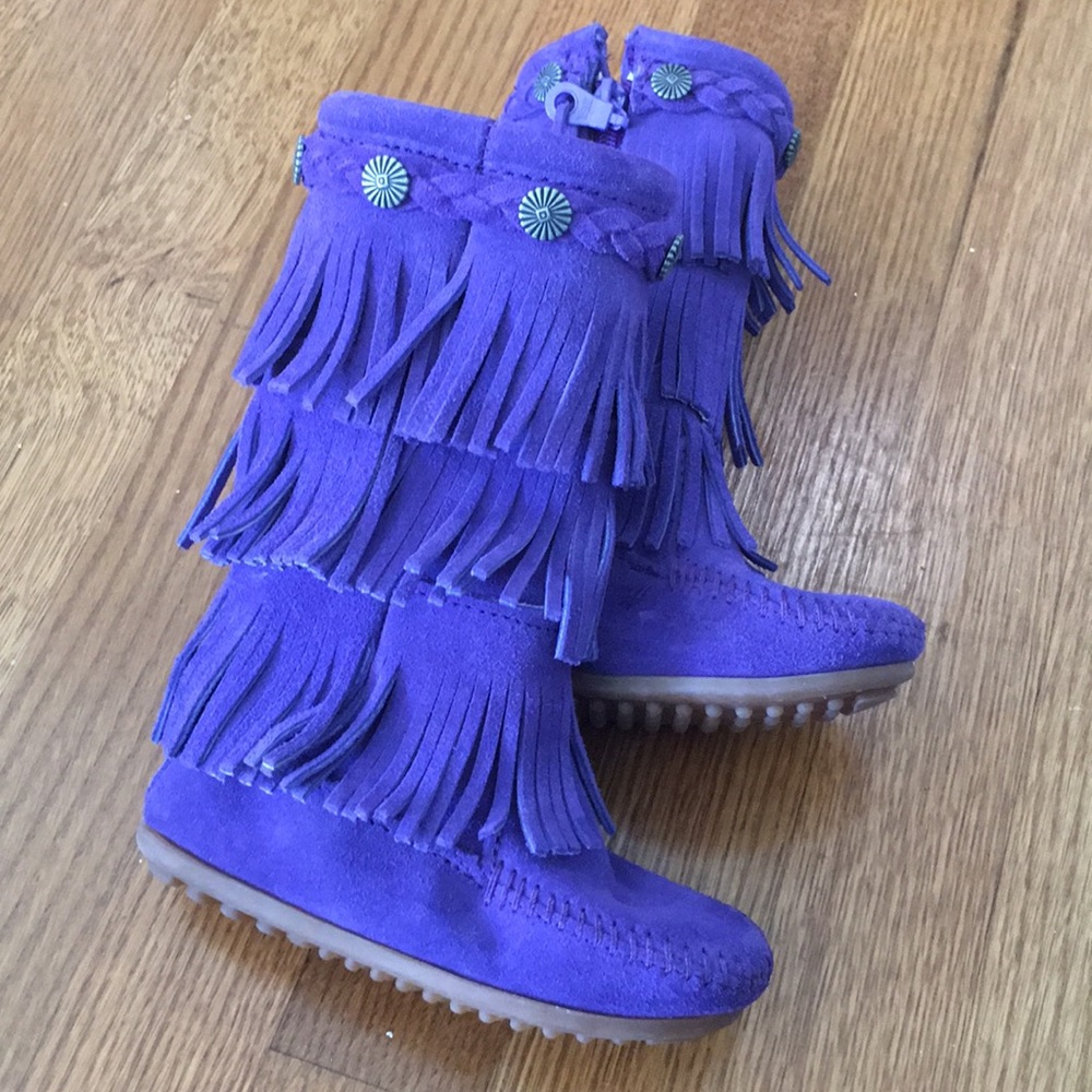 Bright-purple, suede, fringed, Minnetonka boots.